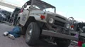 Toyota Landcruiser FJ40, 1960 from Brazil, repairman fixing car HD Footage