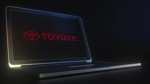 TOYOTA logo made with computer code on the laptop screen. Editorial conceptual Illustrazione stock