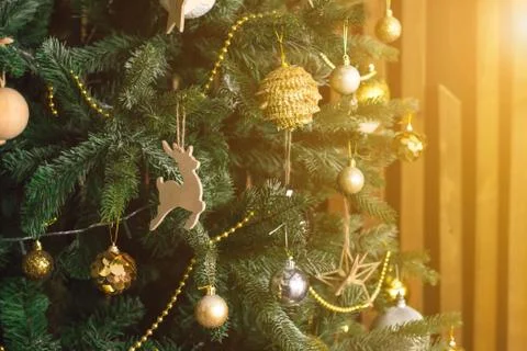 Toys on the Christmas tree. Golden balls, deer, other decorations. New Year Stock Photos