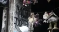 Toys hanging on wire inside burnt building HD Footage