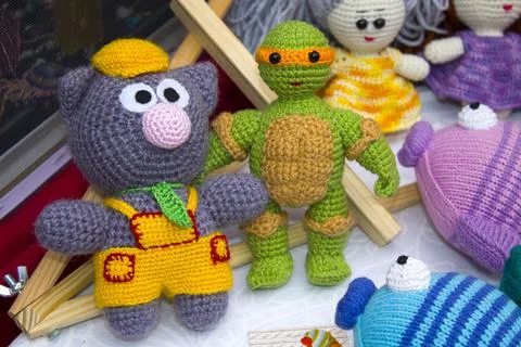 Toys made of knitted threads Stock Photos