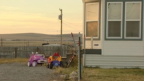 Toys in Yard on Blackfeet Indian Reservation, Montana Stock Footage