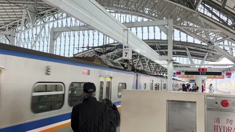TRA EMU700 commuter train arrival and boarding at Taichung station platform Video stock 334575474