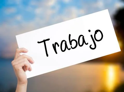 Trabajo  ( work in Spanish) Sign on white paper. Man Hand Holding Paper with  Stock Photos