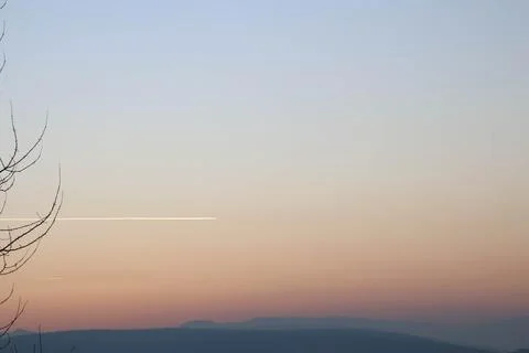 Trace of plane capture during evening time Stock Photos
