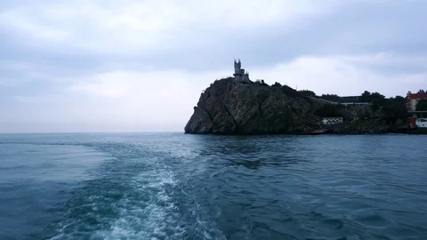 Trace from the ship and a view of the sea and the coast of Crimea Stock Footage 84740336