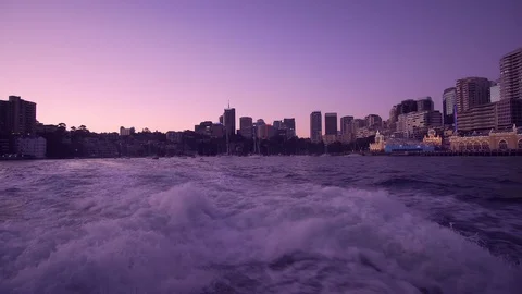 Trace tail of ferry wave on sea in sunset leaving Sydney cityscape Stock Footage 124980682