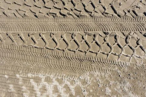 The trace of a tyre in the sand Stock Photos