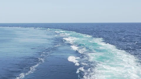 Trace on the water from the turn of the cargo ship Stock Footage 117162999