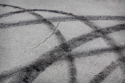 Traces of rubber of protector on asphalt Stock Photos