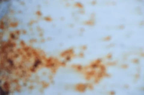 Traces of rust on blue metal. Stock Photos