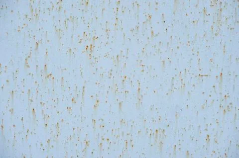 Traces of rust on blue metal Stock Photos