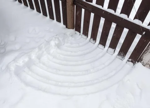 Traces in the snow from the gate Stock Photos