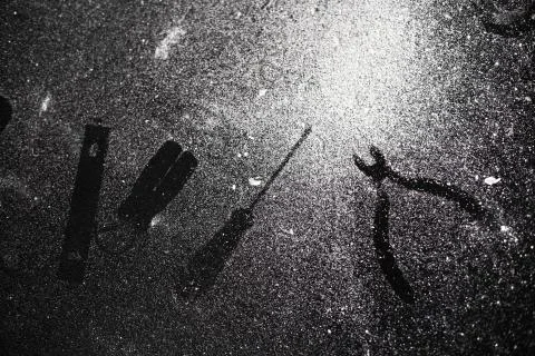 Traces of tools on a black table dusted with white dust Stock Photos