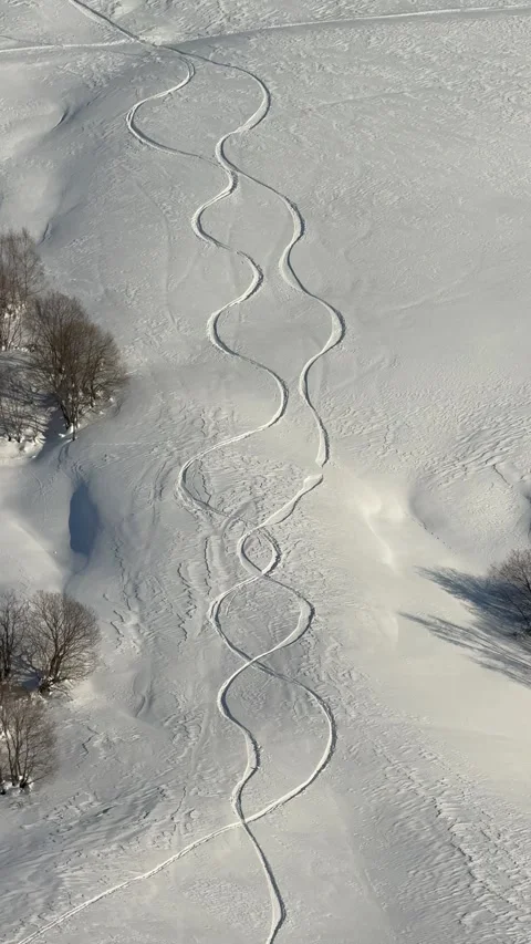 Traces of two snowboards on a pure white mountain slope Stock-Footage 322812714