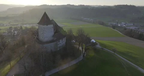 Trachselwald Castle at sunset in spring, heart loop bowl, drone shot, Stock Footage 334347042