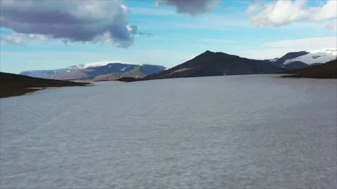 Tracing melting Okjokull glacier thin ice sheet, disappearing into barren Stock Footage 233965352