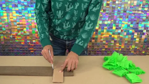 Tracing the pattern onto brown crepe paper Stock Footage 291929190