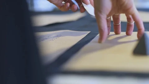 Tracing Pattern on Fabric with Chalk Stock Footage 104815928