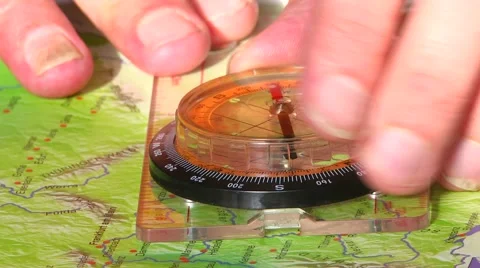 Tracing a route with compass Stock Footage 60043355