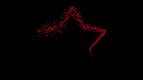 Tracing with tiny red colored particles on the STAR with dark screen background Stock Footage 289217364