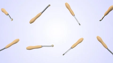 Tracing Wheels Falling on a Light Blue Background. Pattern and Dart Wheel. 4K Stock Footage 304868618