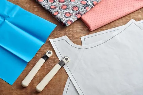 Tracing wheels, sewing patterns and transfer paper for tailoring Stock Photos