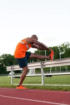 Track and Field Runner Stretching Stock Photos