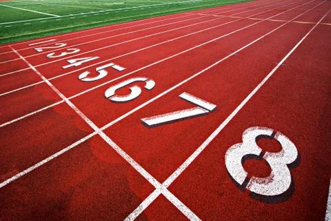 Track and field starting lane numbers 1-8. Stock Photos