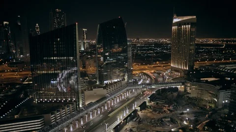 Track back at 80m from Emaar Square to reveal Burj Khalifa, night. Stock Footage 98969438