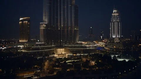 Track back from base of Burj Khalifa while descending from 80m to 40m, Stock Footage 98989145