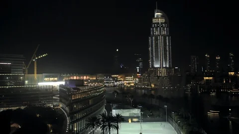 Track back while ascending from 20m to 50m to reveal entrance to Burj Khalifa, Stock Footage 98961328