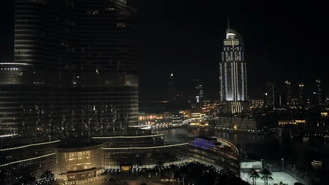 Track back while ascending from 50m to 100m to reveal both entrances to Burj Stock Footage 98962406