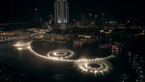 Track back while ascending from 50m to 100m above Dubai Fountain, night. Stock Footage 98971044