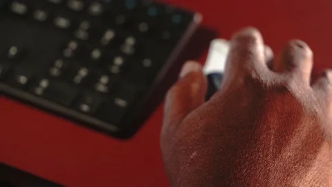 Track ball keyboard typing black man working computer at desk Stock Footage 234512547
