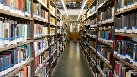 Track in between two rows of bookshelfs in israel national library Stock Footage 118007341