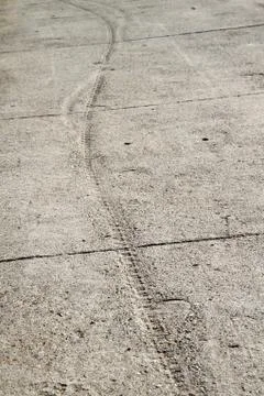 Track in cement sidewalk Stock Photos