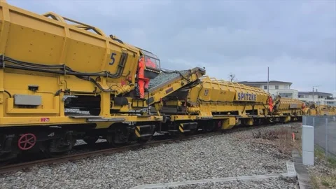 Track construction work on the railway line, track - ballast cleaning Stock Footage 305321294