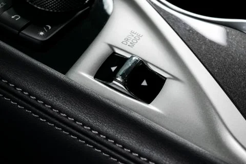 Track control buttons near automatic gear stick of a modern car in black leat Stock-Fotos