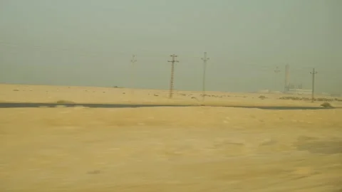 A track in the desert, a view from the window of a car walking along a road in Video stock 278025403