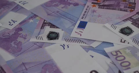 A track of euro bills lying on the table in an even layer. Solid phonon from Stock Footage 232724176