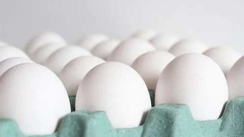 Track focus on an egg tray, white chicken eggs Video stock 82843929