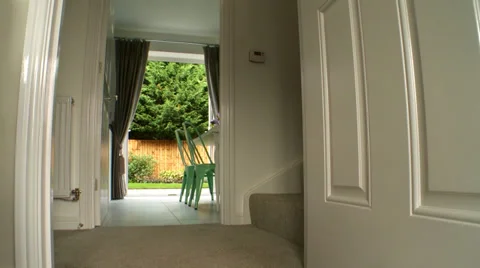 Track forward through Hallway of Modern House towards Dining Room Stock Footage 35599322