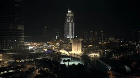 Track forward while descending from 50m down to 20m from Burj Kahlifa towards Stock Footage 98961540
