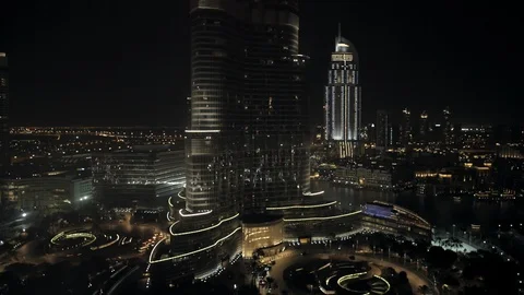 Track left at 100m to reveal both entrances to Burj Khalifa, night. Stock Footage 98960904