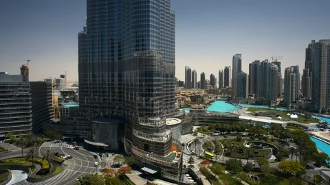 Track left at 40m over Burj Khalifa entrance fountain. Stock Footage 98930149