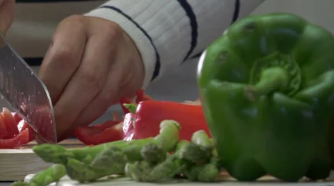 Track Left Across Woman Cuting a Red Pepper Stock Footage 59356940