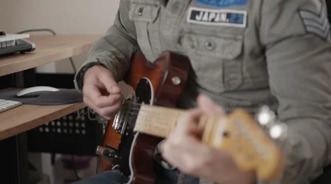 Track left and right of man playing electric guitar Stock Footage 50244682