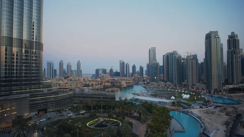Track left past base of Burj Khalifa at 60m, sunset/evening, dusk. Stock Footage 98953461