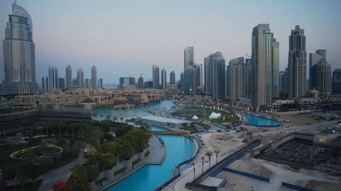 Track left past base of Burj Khalifa at 60m, sunset/evening, dusk. Stock Footage 98954829